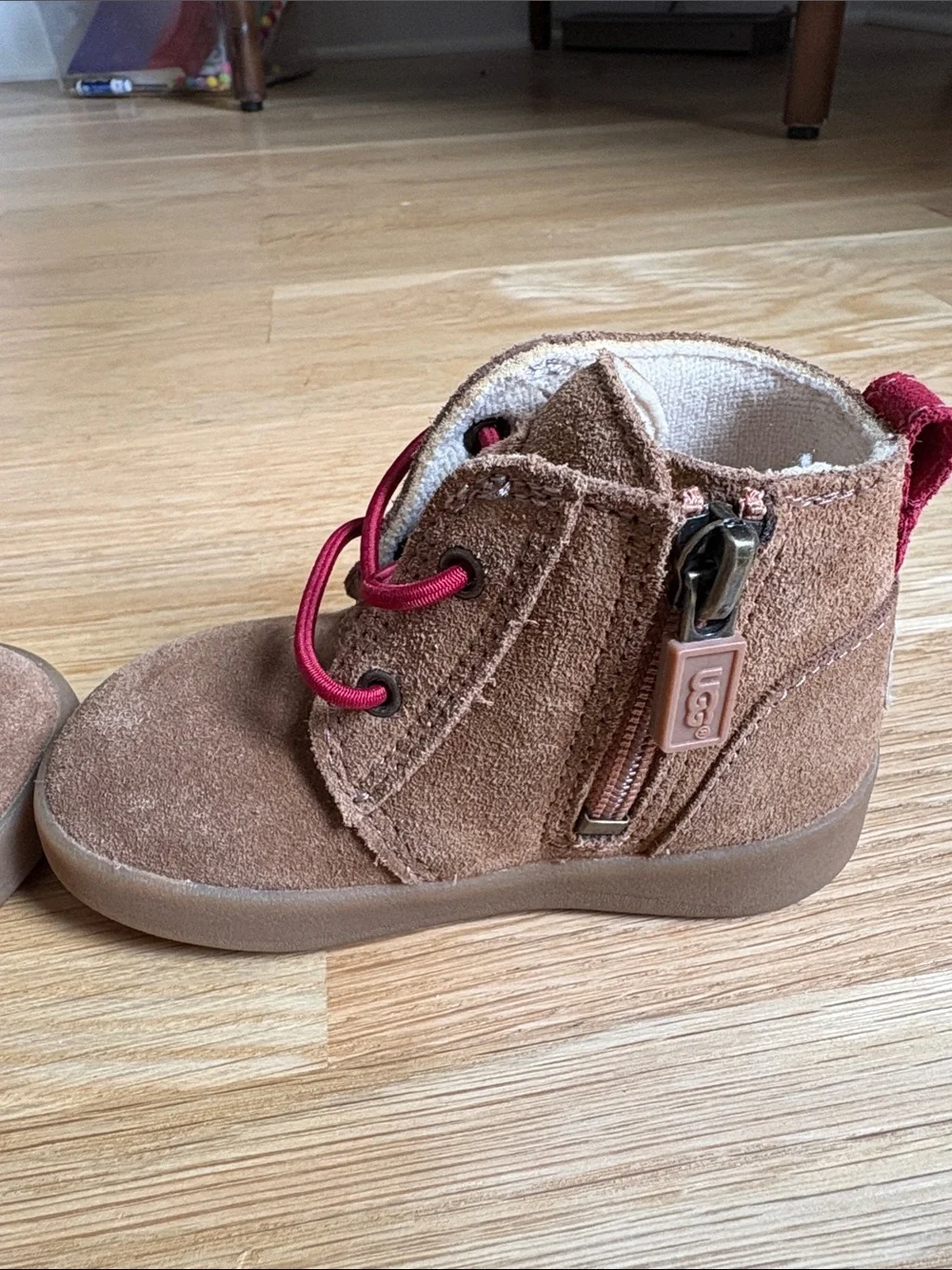 UGG Kids | Brown Suede Zip Ankle Boots with Red Trim